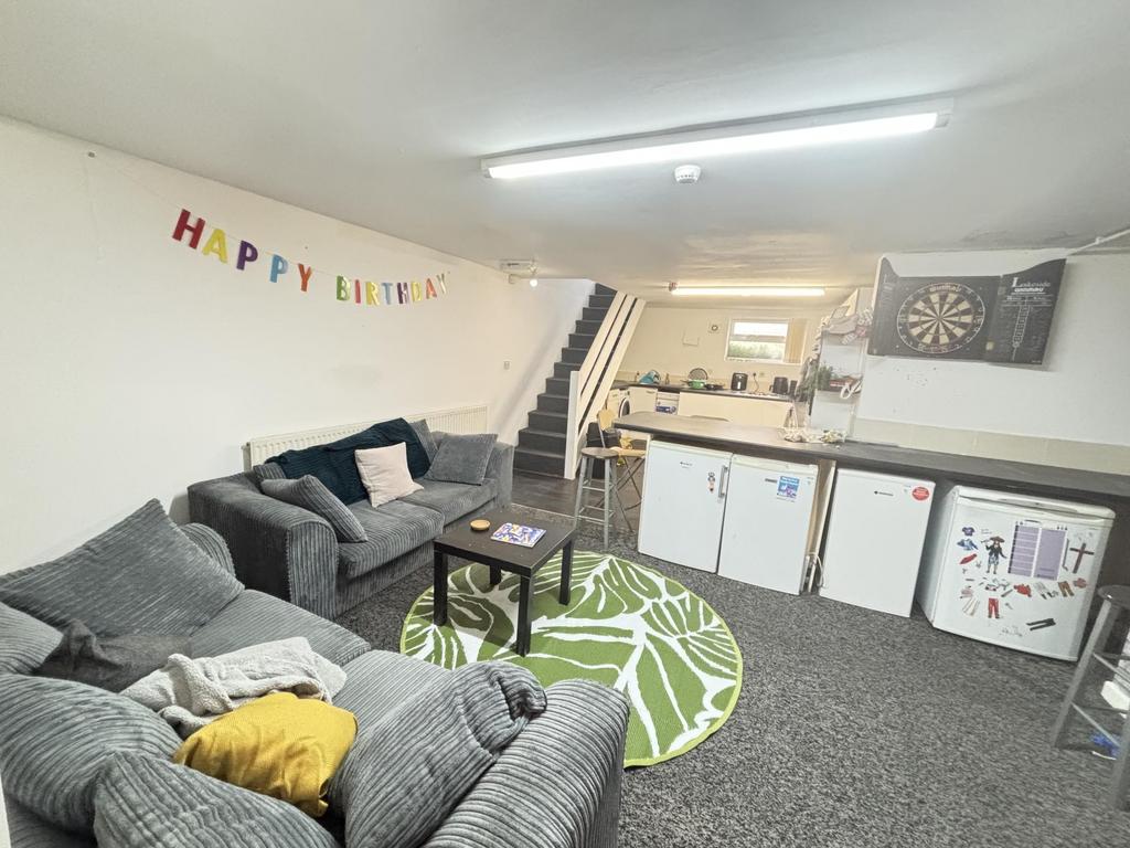 A cozy and well-maintained living room featurin...
