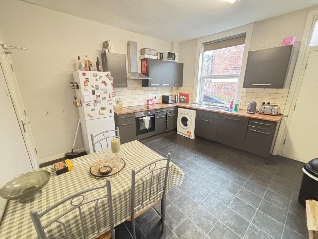 A well-lit, modern kitchen with ample counter s...