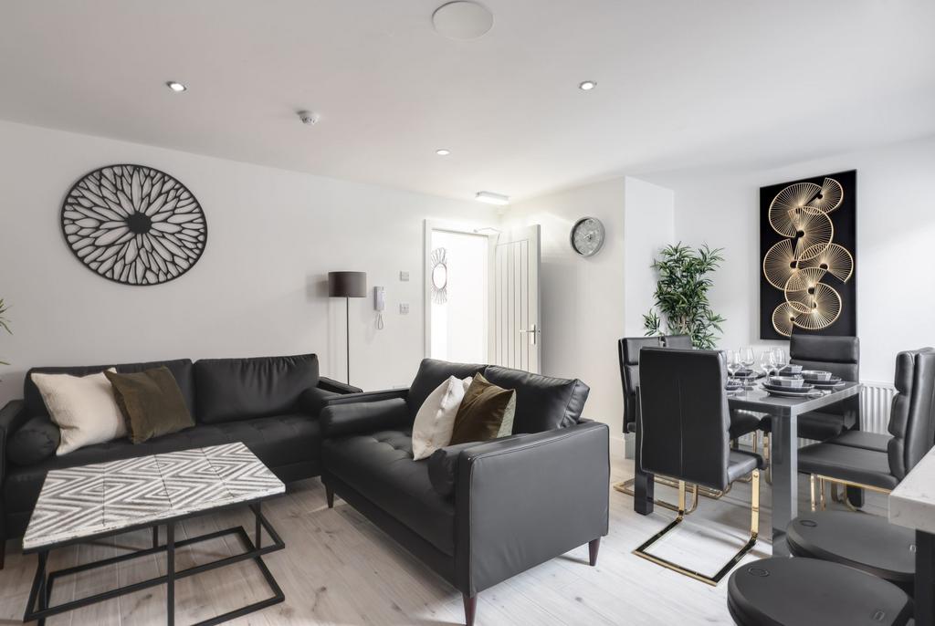 Bright and contemporary living room with sleek ...