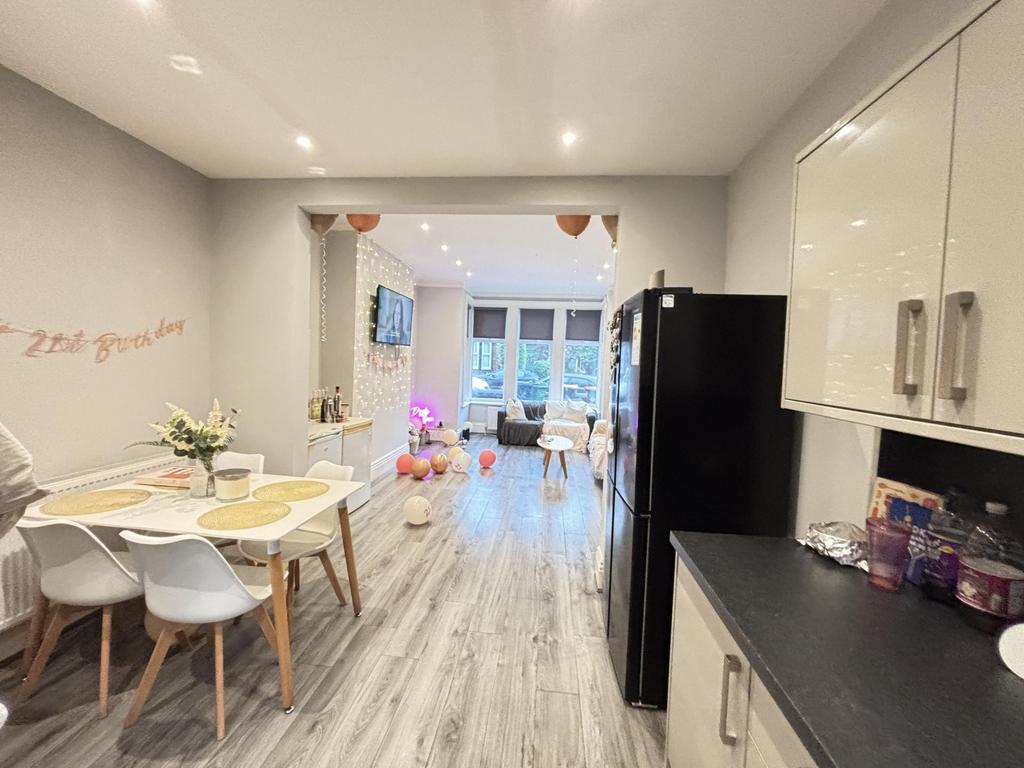 A bright and spacious living room featuring lar...