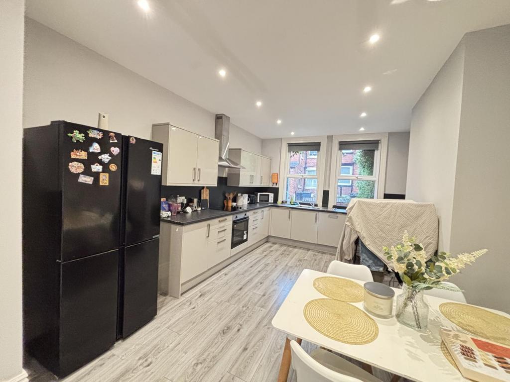 A bright and modern kitchen with ample natural ...