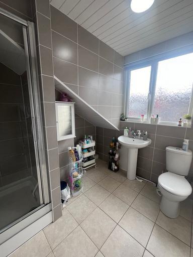 A clean, well-maintained bathroom featuring a s...