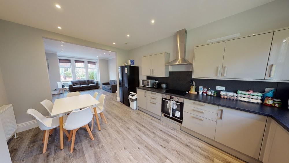 Modern and well-lit kitchen area featuring slee...