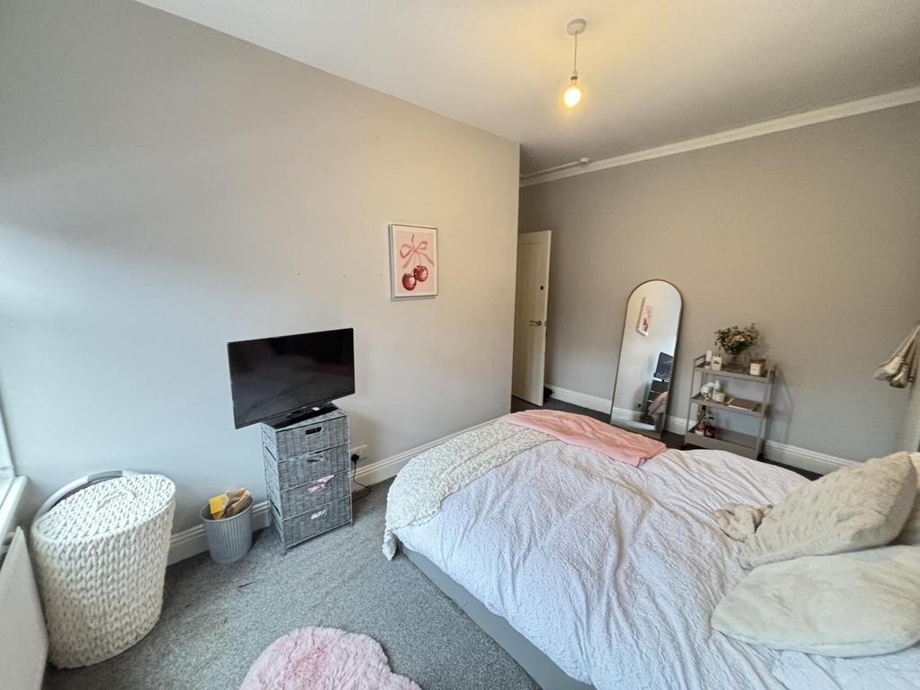 Spacious and inviting master bedroom featuring ...