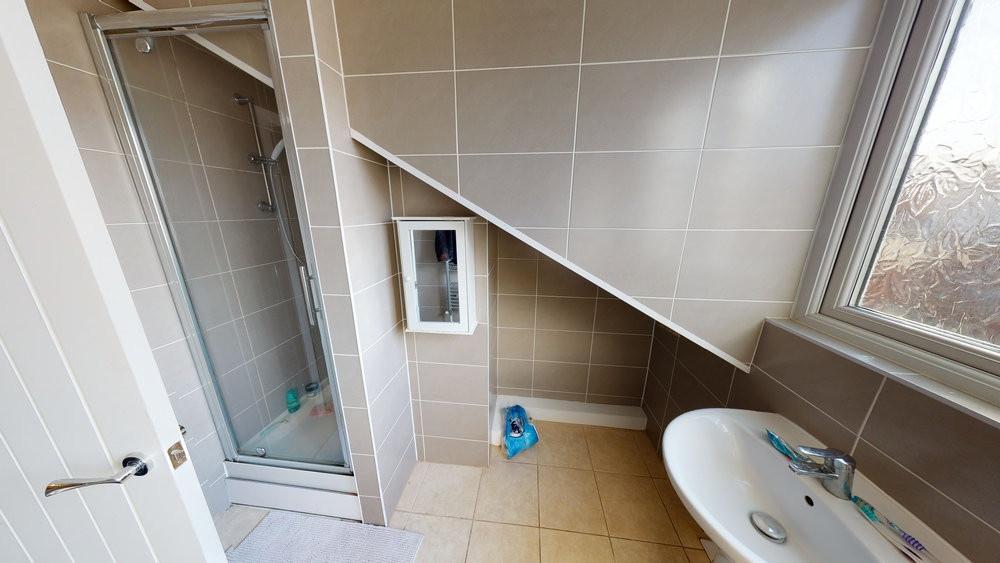 A bright and well-maintained bathroom with a la...