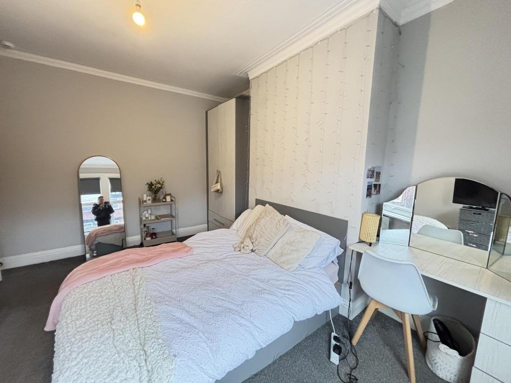 A spacious and well-maintained master bedroom f...