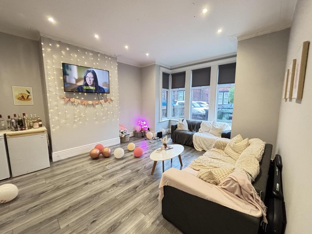 A modern and well-lit living room featuring a c...