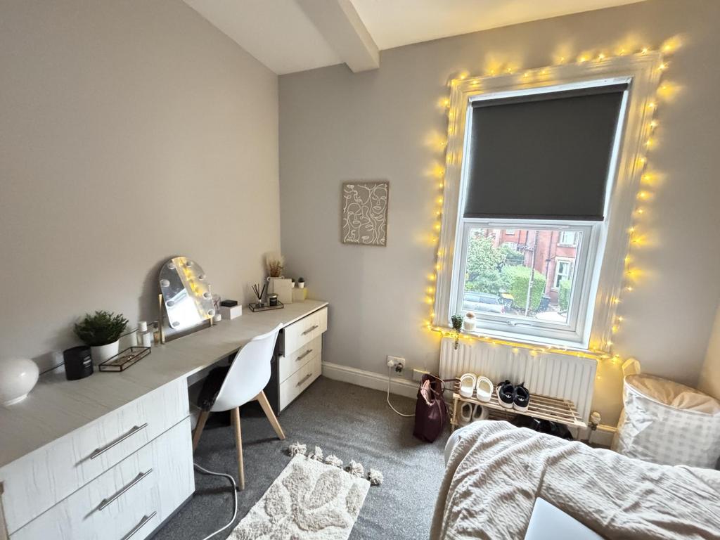 Bright and inviting bedroom with a cozy atmosph...