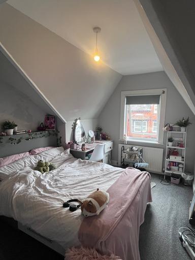 A cozy, well-maintained bedroom with good natur...