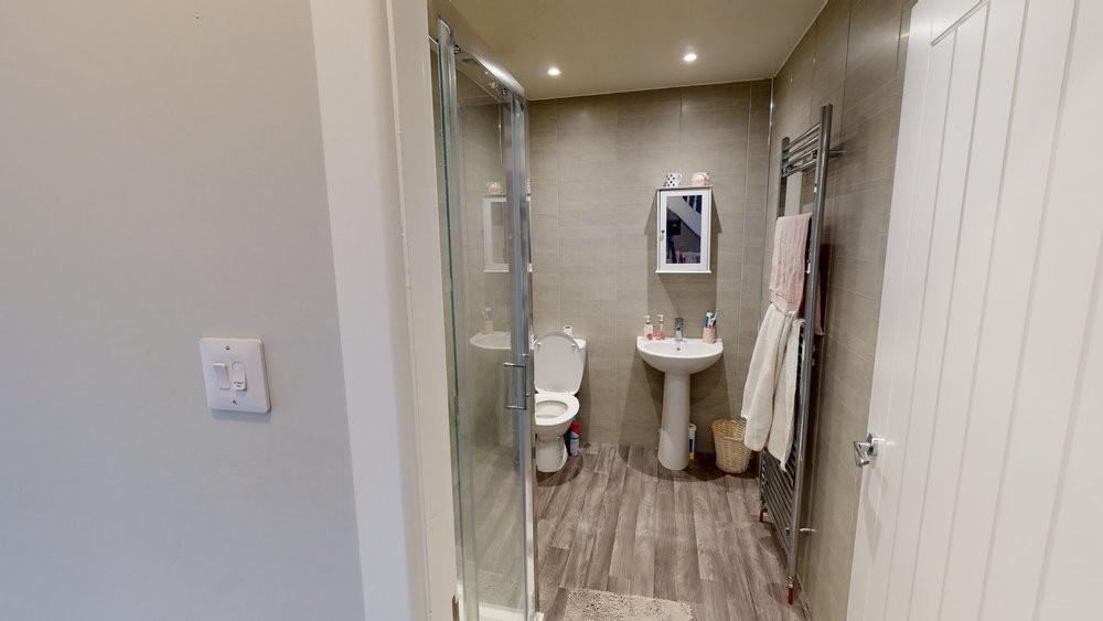 A well-maintained bathroom with a spacious show...