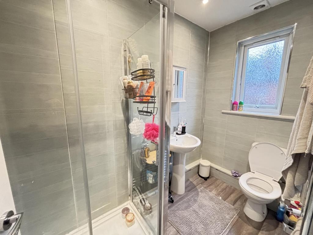 A bright and well-maintained bathroom with a mo...
