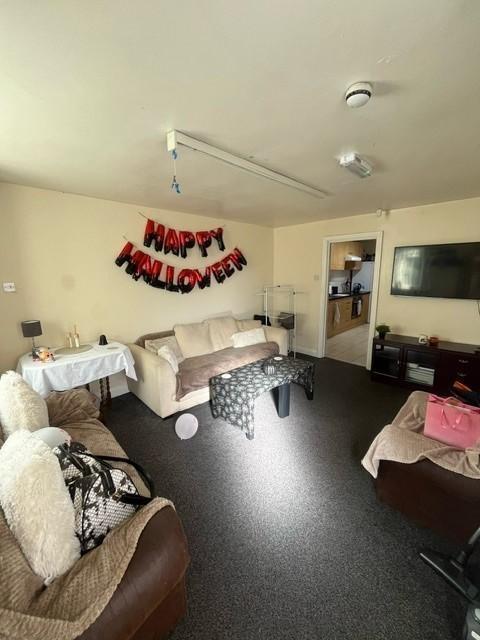 A cozy and welcoming living room decorated for ...