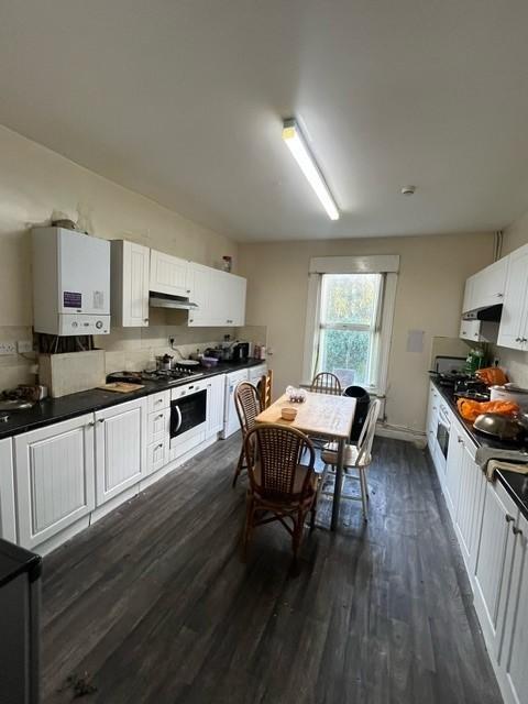 Bright and airy kitchen with ample natural ligh...