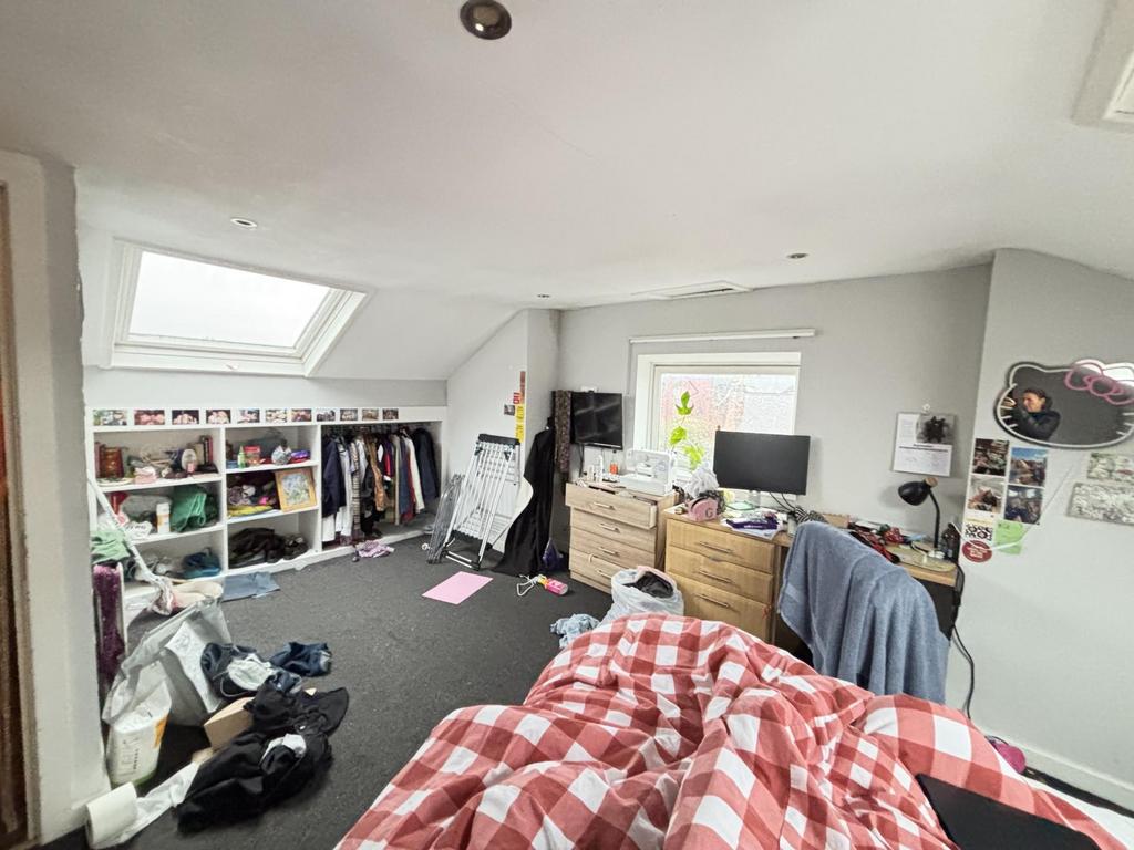 A cozy double bedroom with natural light coming...