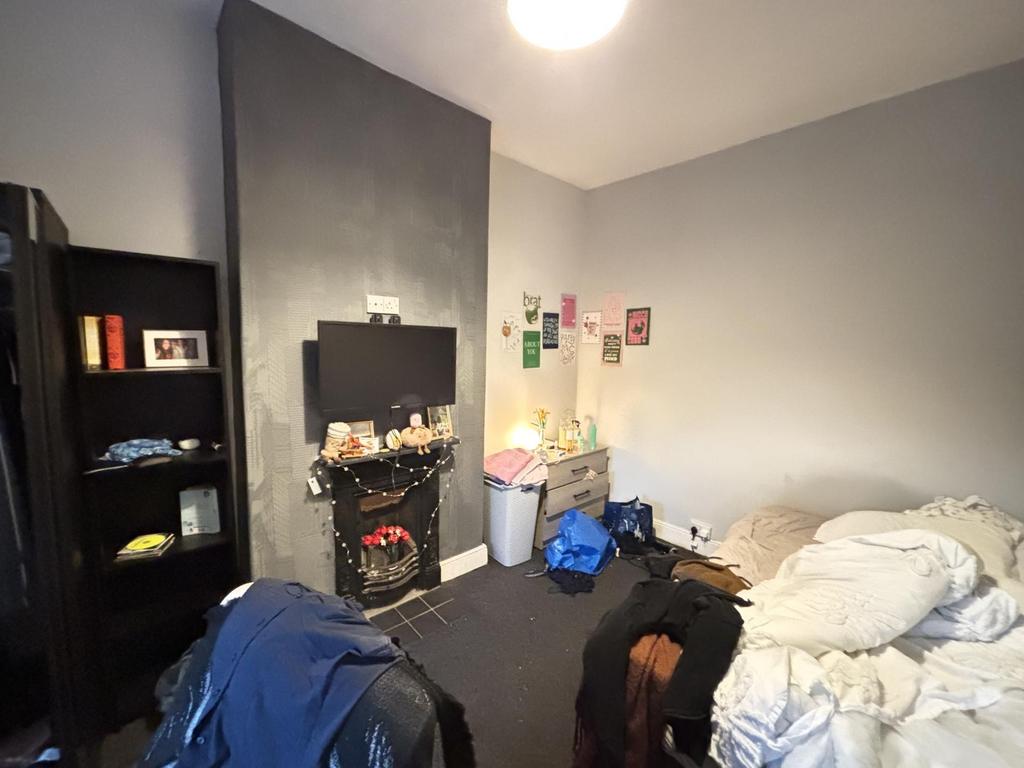 A comfortable bedroom with a cozy atmosphere, f...