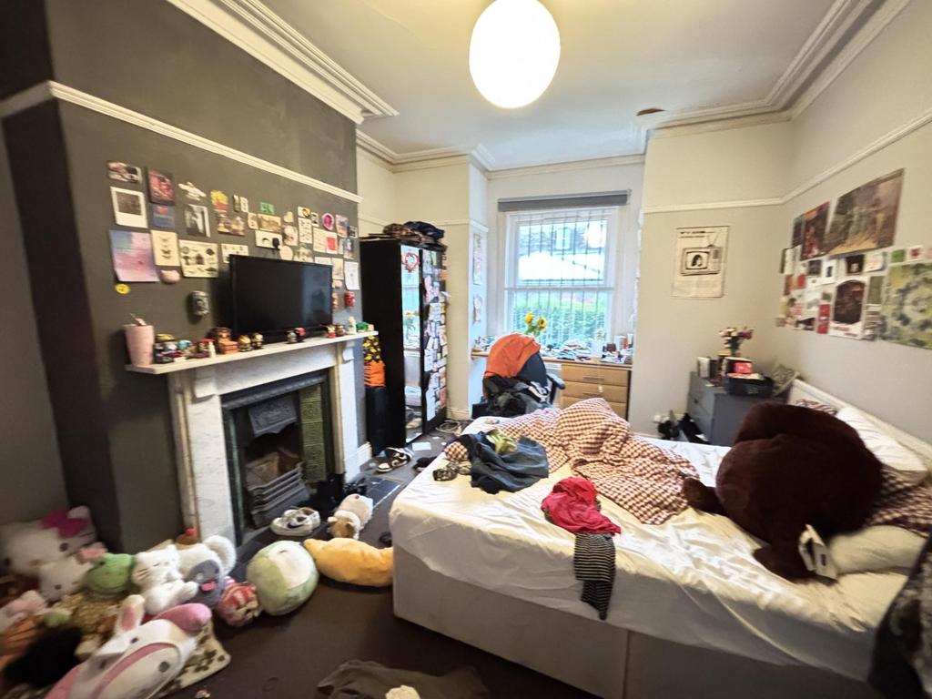 A spacious and lively living room filled with n...