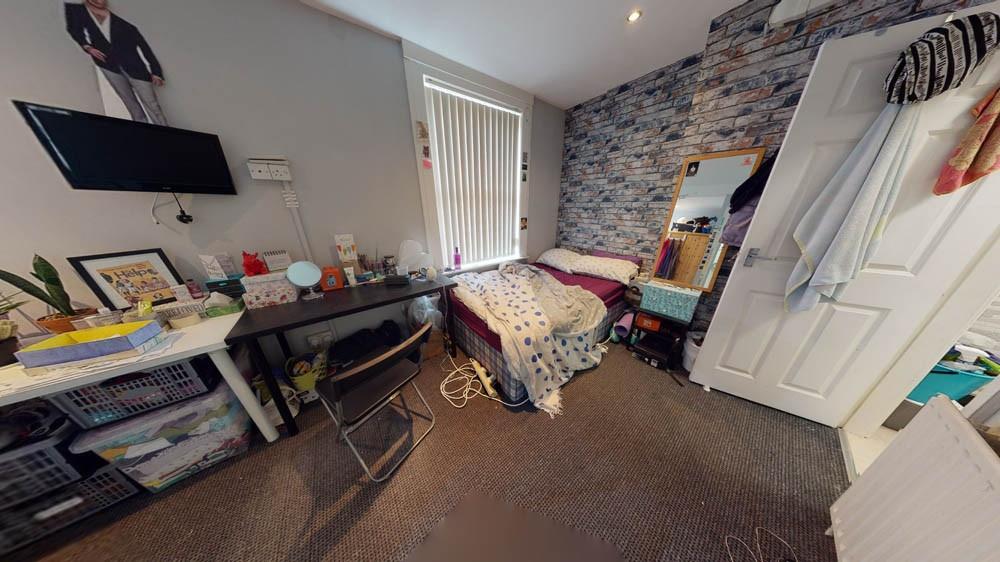 A cozy, lived-in living room with ample space f...