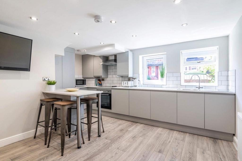 Modern and bright kitchen with ample counter sp...