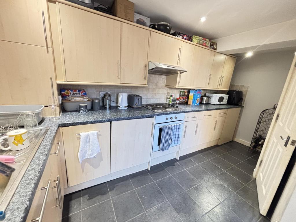 A well-maintained kitchen with ample cabinetry ...