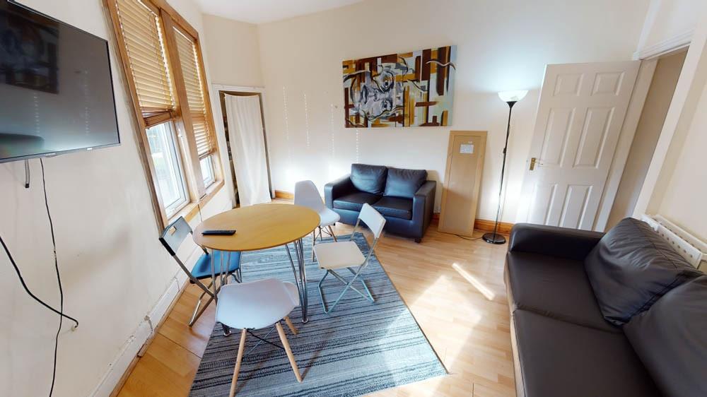 A bright and well-maintained living room featur...