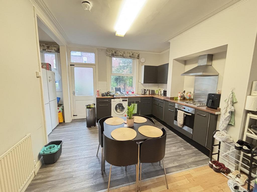 A modern, well-lit kitchen featuring ample coun...