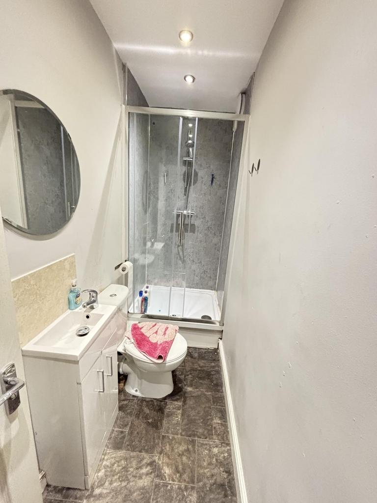 A clean and modern bathroom featuring a spaciou...