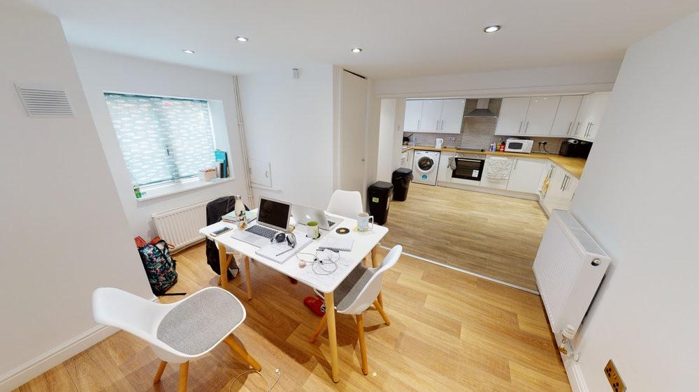 A bright and welcoming living room featuring mo...