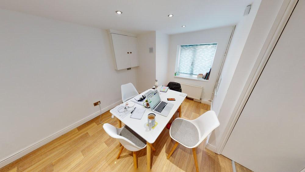 Bright and modern living room featuring ample n...