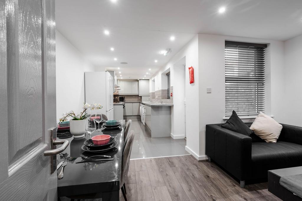 Modern and stylish living room featuring a comf...