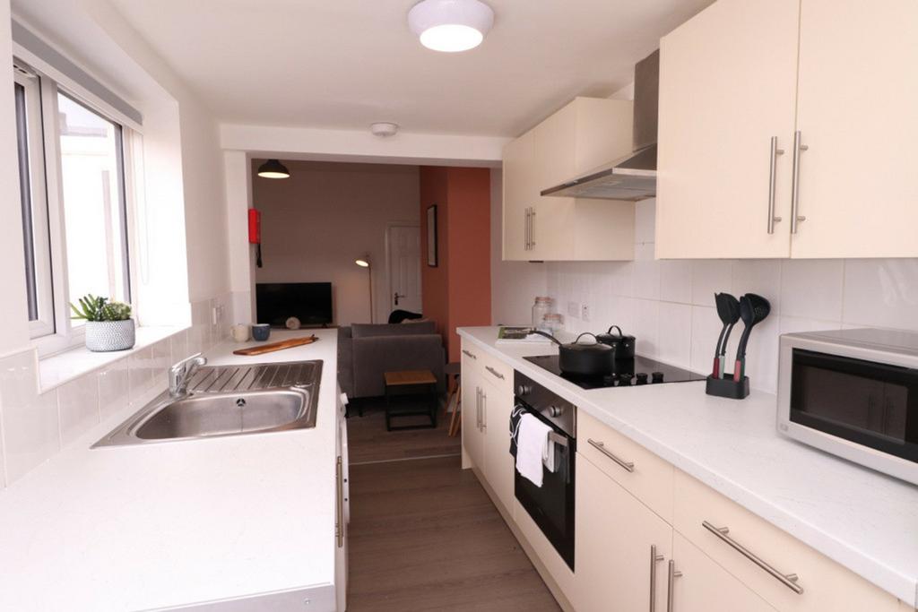 A bright and modern kitchenette featuring sleek...