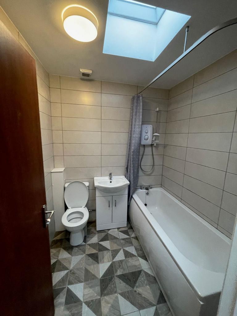 A clean and well-maintained bathroom featuring ...