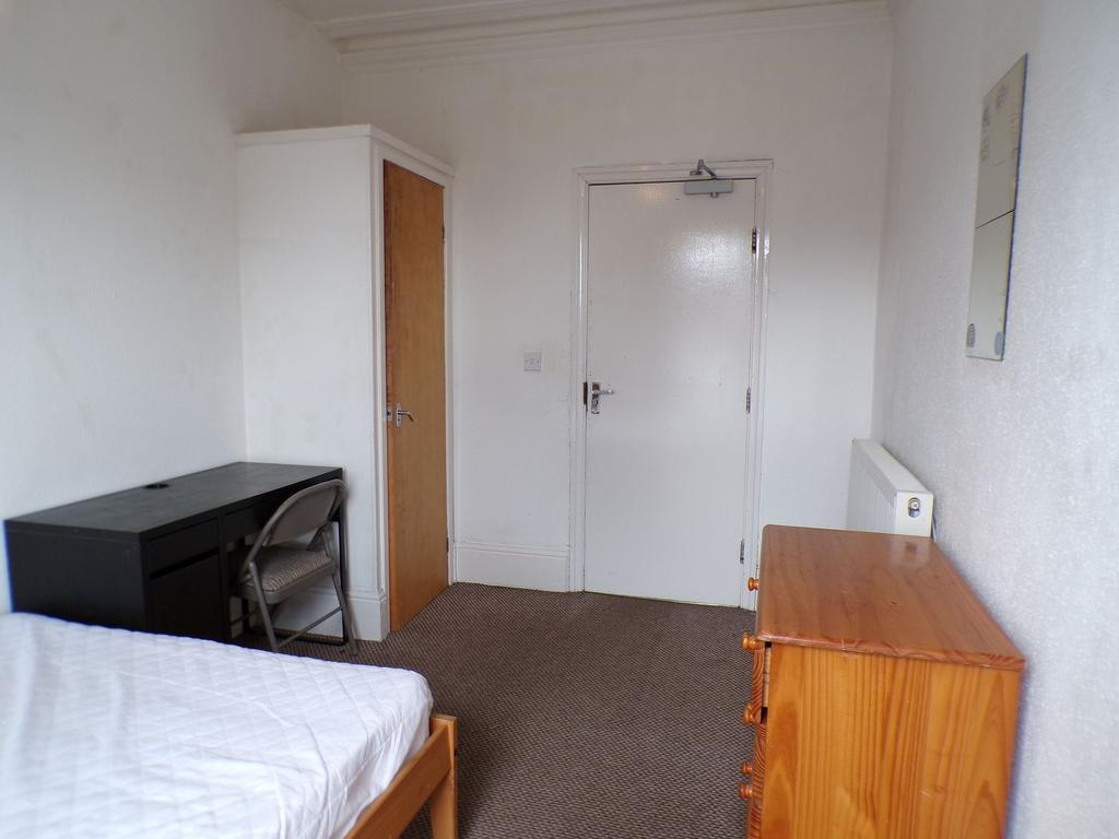 Simple furnished single bedroom with a single b...