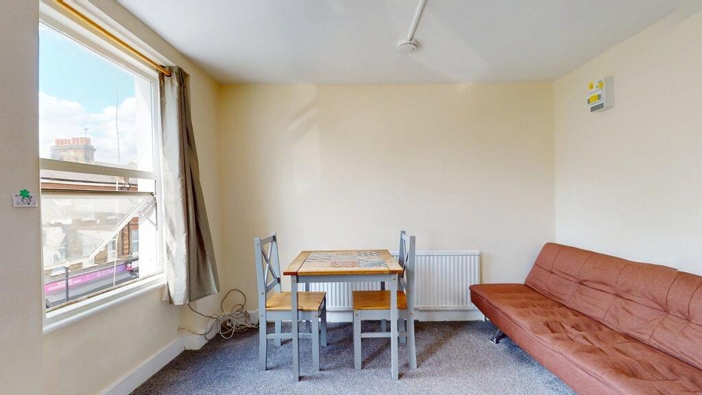 A cozy living room with a large window letting ...