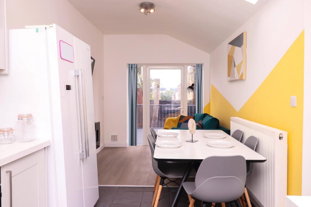 A bright and modern kitchenette with a stylish ...