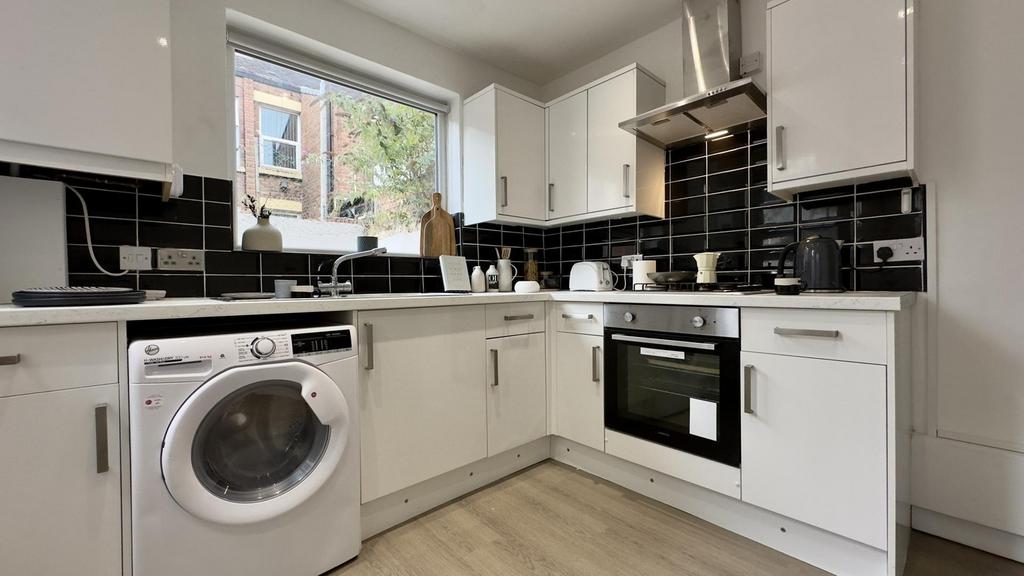 A modern and well-equipped kitchenette with amp...