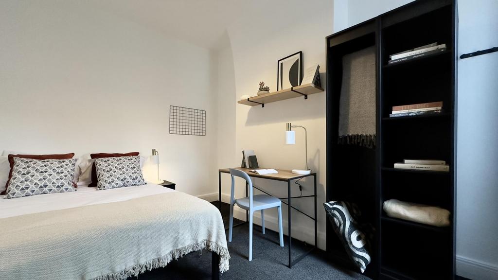 A stylish and inviting double bedroom with a co...