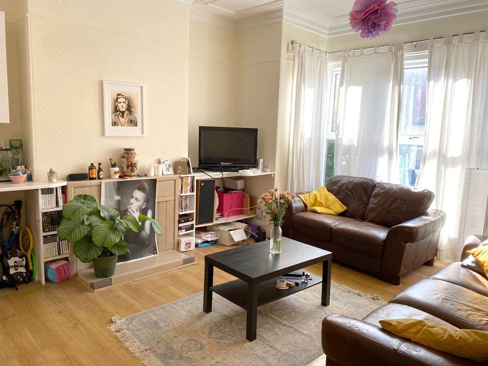 Bright, welcoming living room with large bay wi...