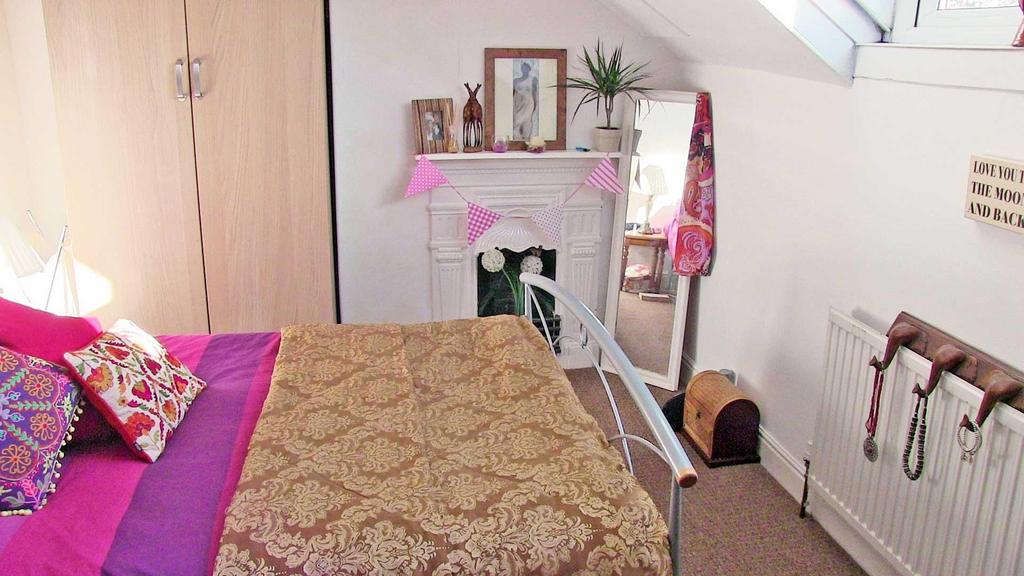 Bright, neatly styled double bedroom with patte...