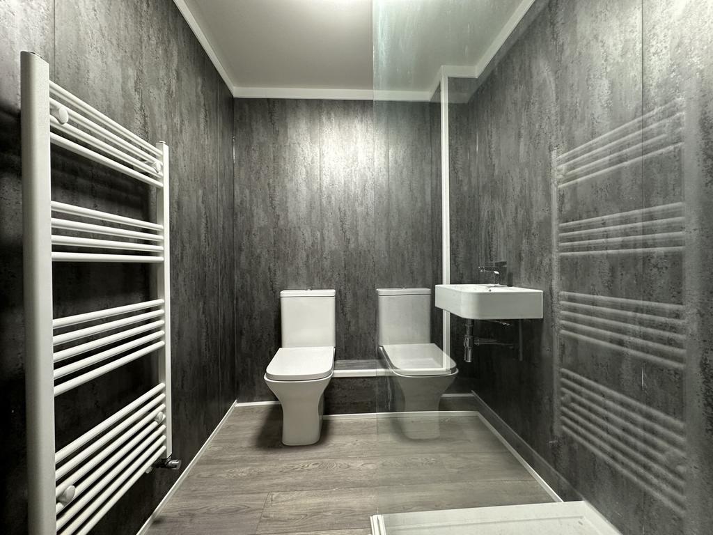 A modern and clean bathroom featuring contempor...