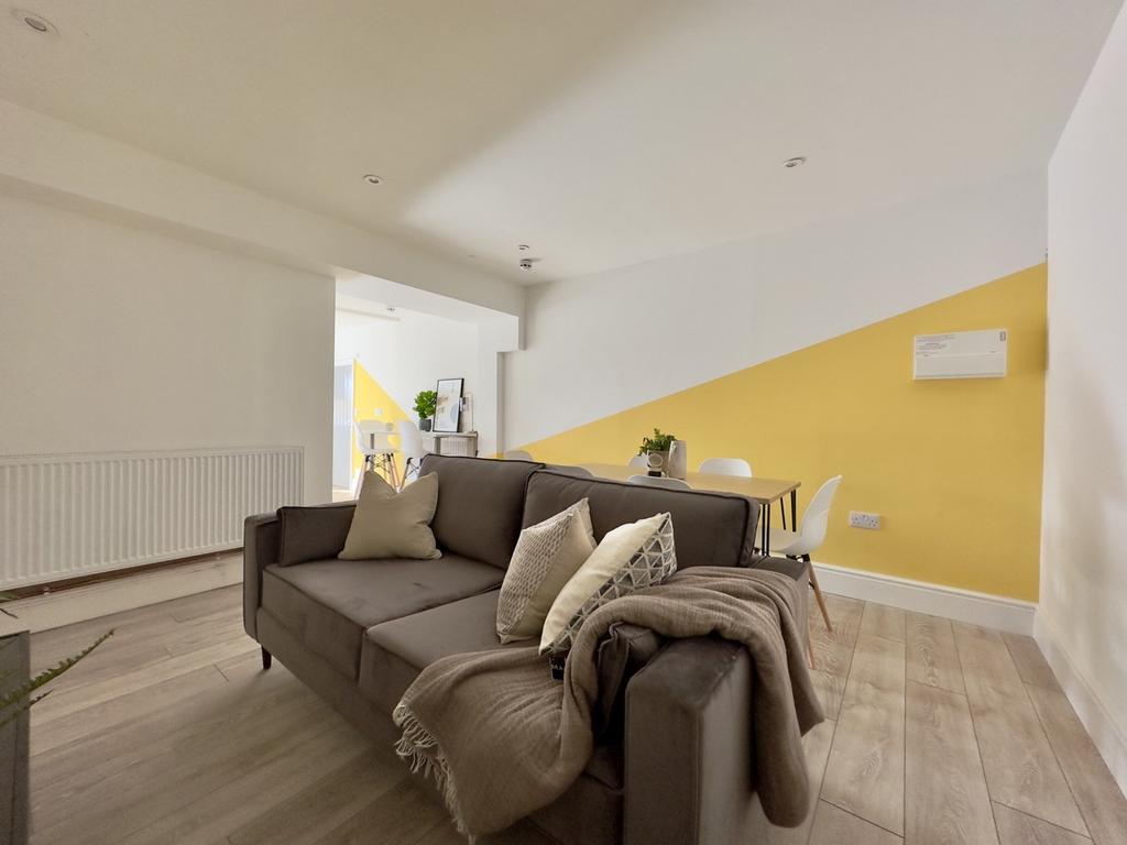 A bright and inviting large modern living room,...