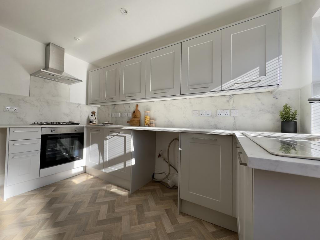 A stylish and modern kitchen featuring ample st...