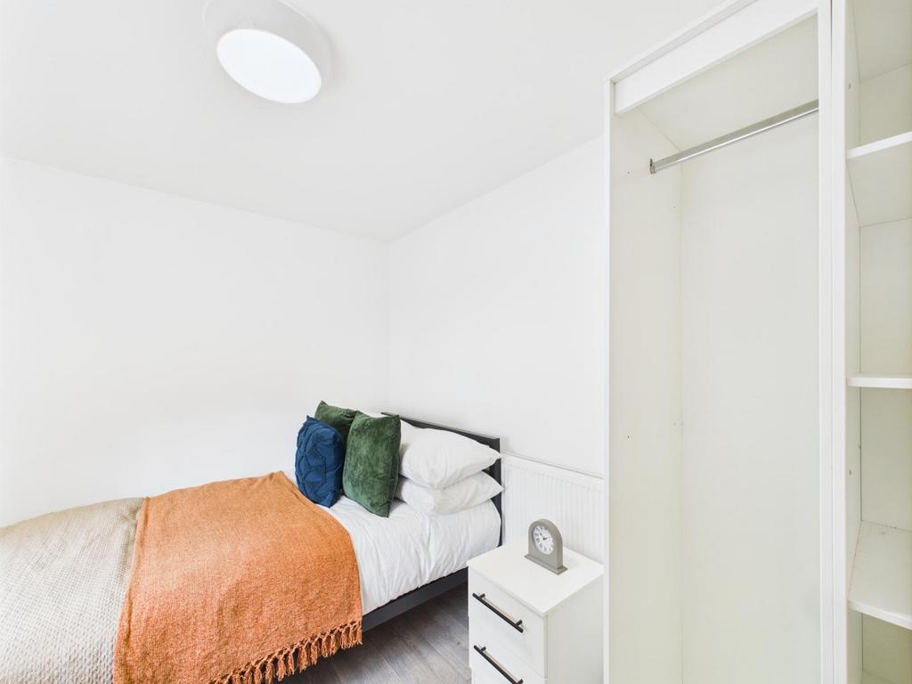 Bright, freshly decorated bedroom with a neatly...