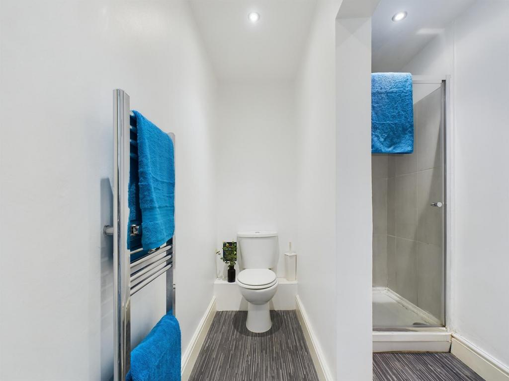 A bright and tidy bathroom featuring modern fix...