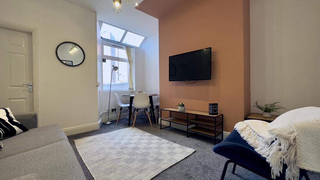 A stylish and inviting living room perfect for ...