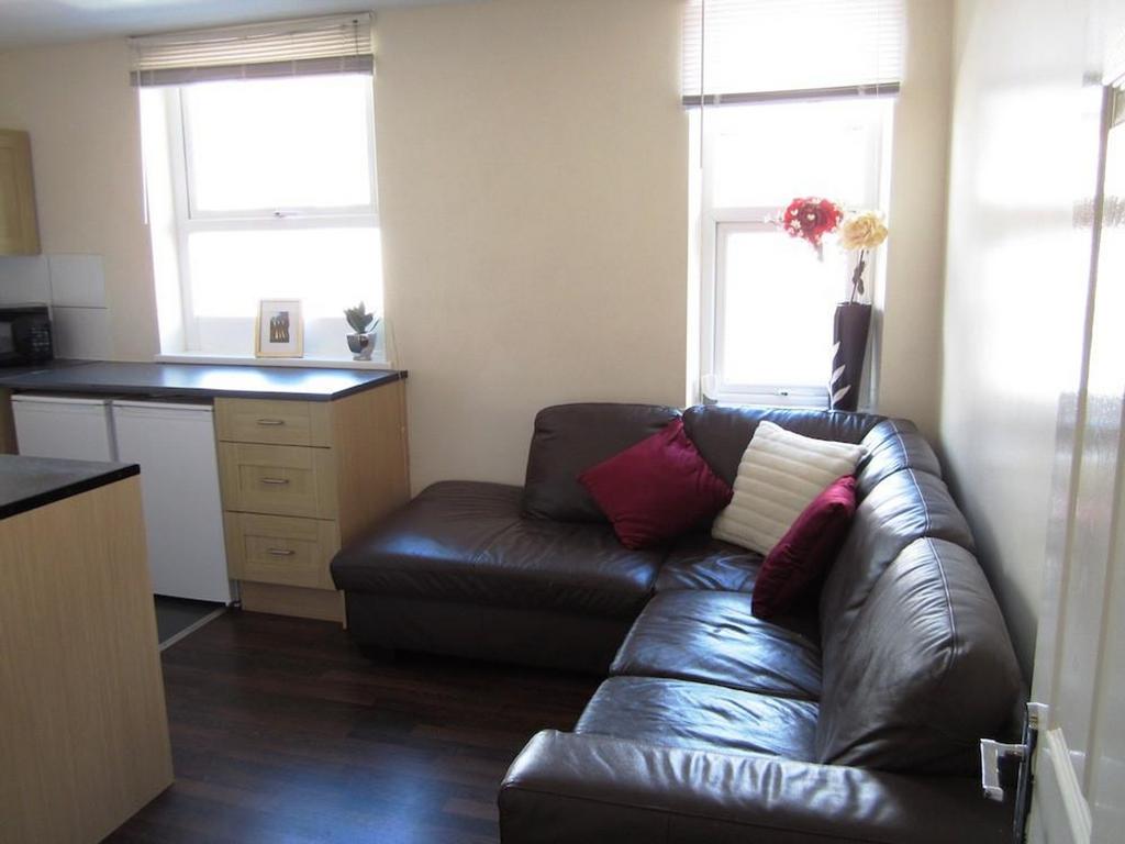A cozy and inviting living room featuring ample...