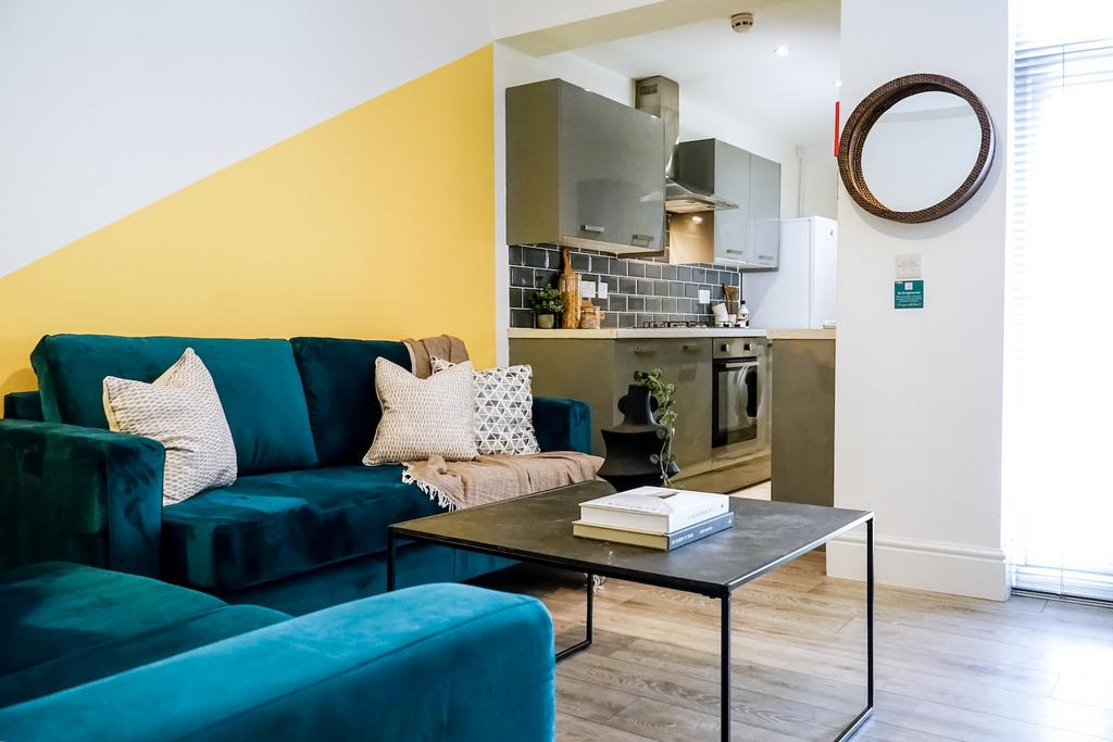 A bright and modern living room featuring a dee...