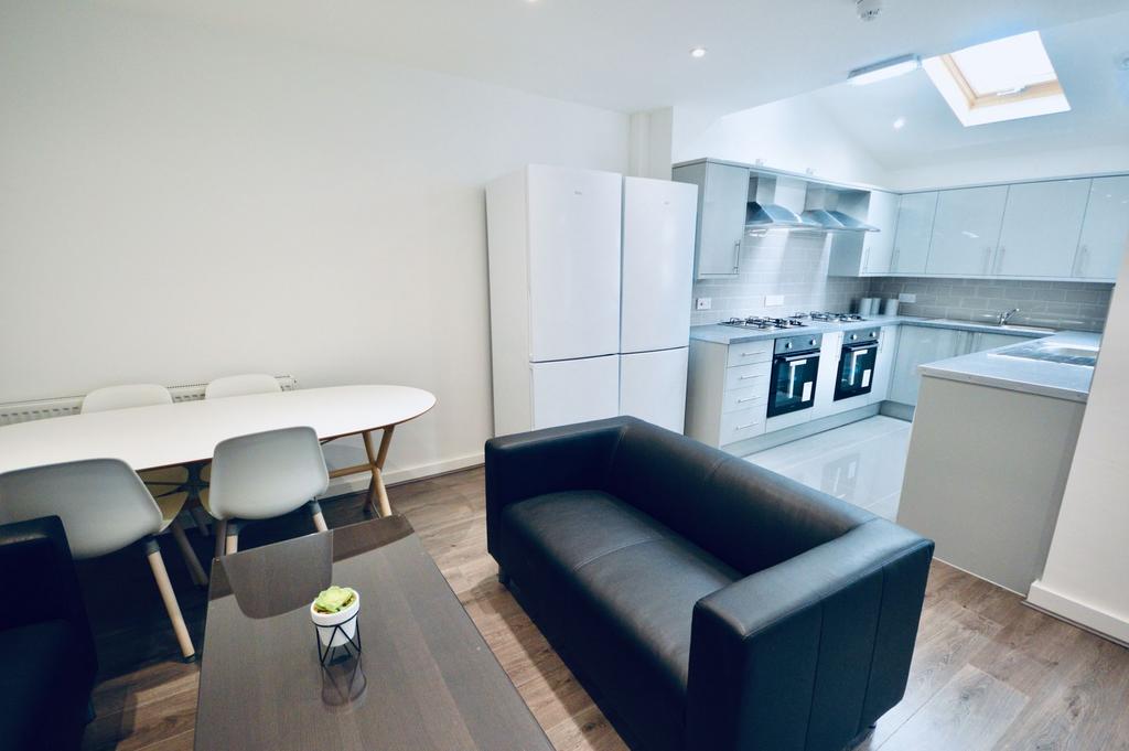 Bright and modern living area featuring a comfo...