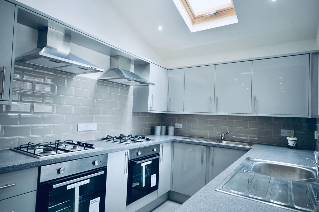 Modern and well-maintained kitchen featuring sl...