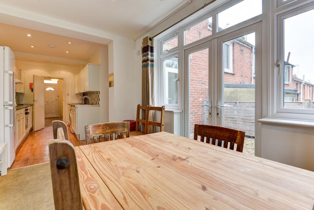 Bright and welcoming living room with large win...