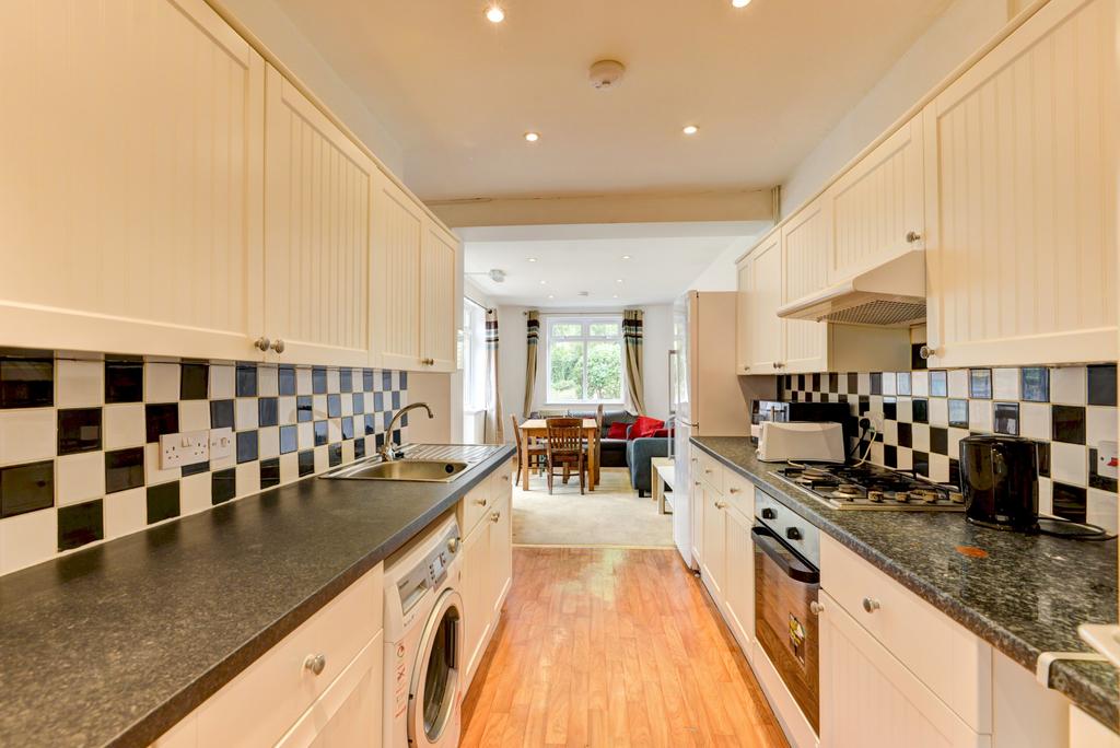 Bright and functional kitchen with modern black...